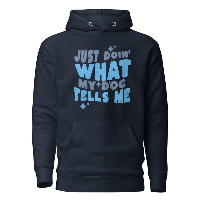 Navy pullover hoodie with blue and slate “Just Doin’ What My Dog Tells Me” graphic and star accents on a white background.