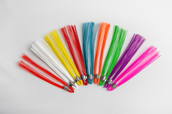 various colored whiskers on light gray backdrop