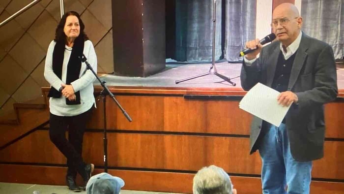 EPA press officer Jo Ann Kittrell (L) listens as Lee Select Board member Bob Jones delivers public comments on GE’s proposed PCB cleanup. // Source - Community Television Of The Southern Berkshires 