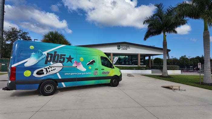 The PB5star wrapped Sprinter van parked in front of USOP National Pickleball Center in Naples, Florida.