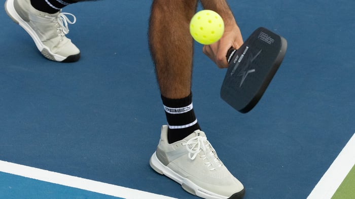 Close up shot of pickleball about to hit a racket