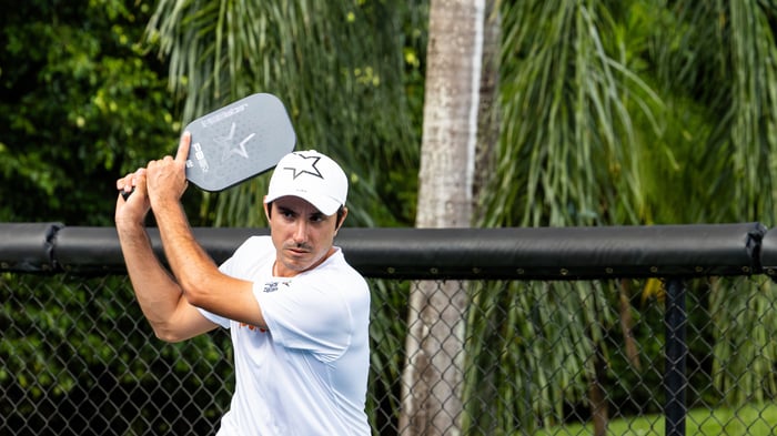 Pickleball player returning a shot