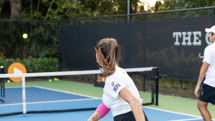 Pickleball player taking a shot
