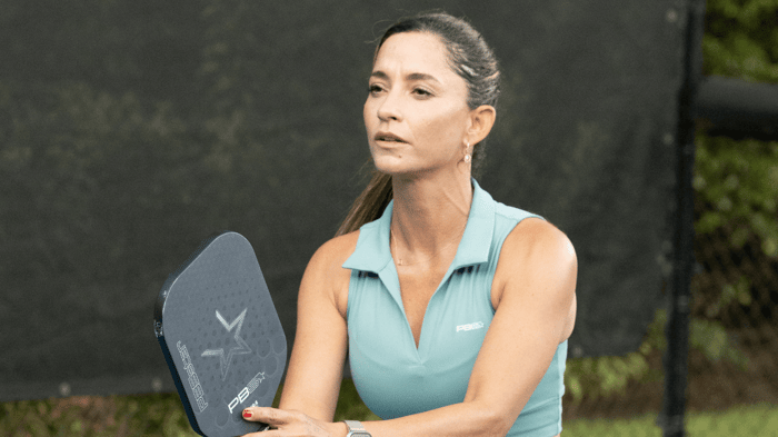 Pickleball player bracing for a shot