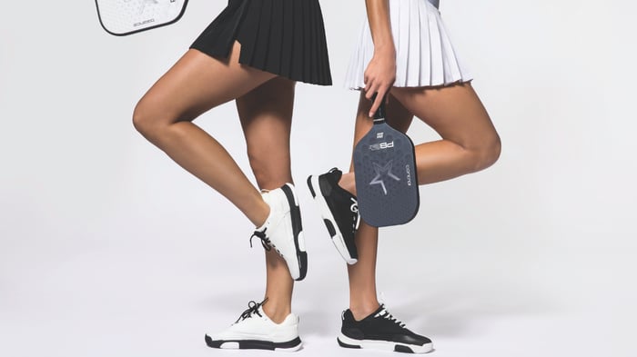 Pickleball players in apparel standing back to back