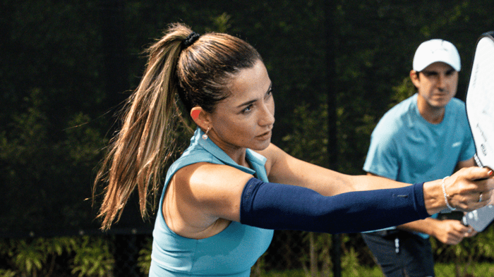 Pickleball player returning a shot