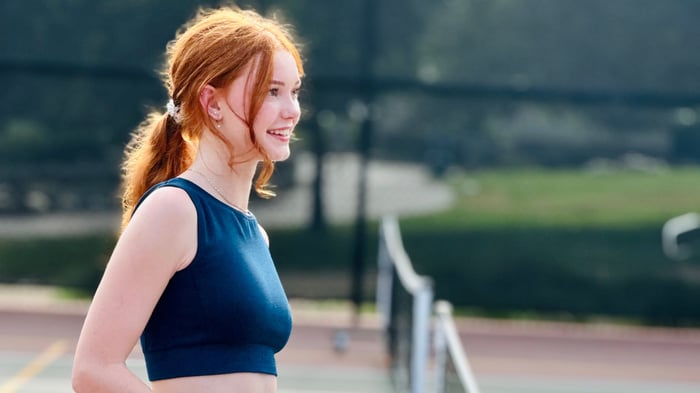Female pickleball player ready for a game on the court