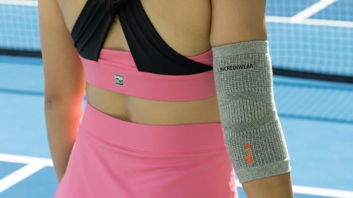 Woman in matching pink pickleball activewear set