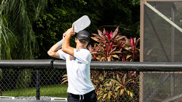 Pickleball player positioning to receive