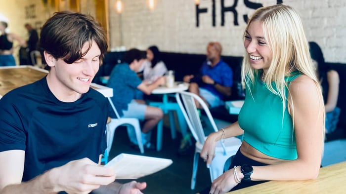 Two pickleball players discussing their game