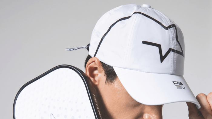 Person in a Pickleball cap