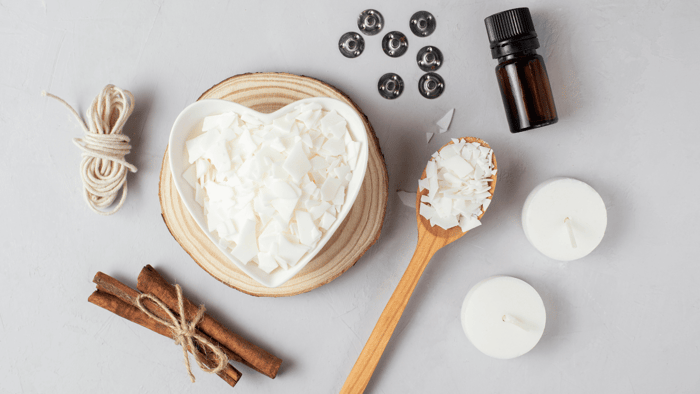 Candle and wax melt ingredients on a workspace, illustrating the legal requirements for selling candles and wax melts in the UK