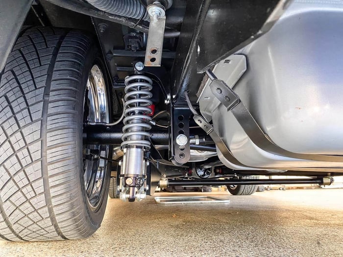 Suspension close-up showing the coil spring and shock placement.