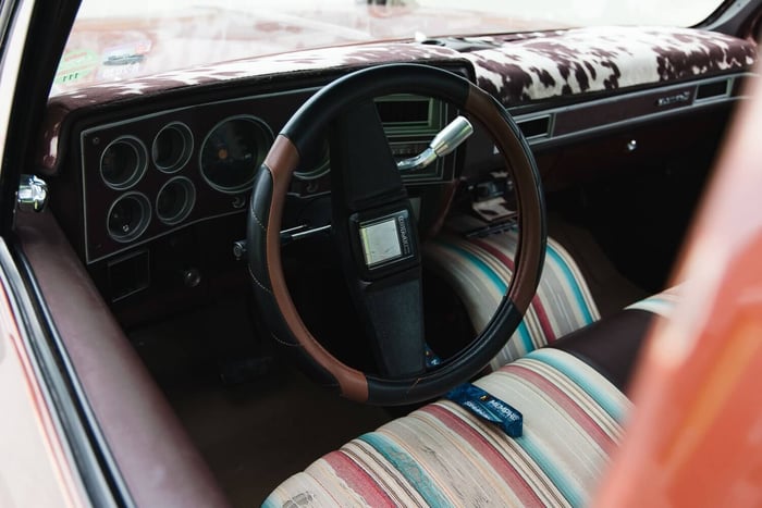 Interior shot of factory bench seat with vinyl and Hobby Lobby fabric.