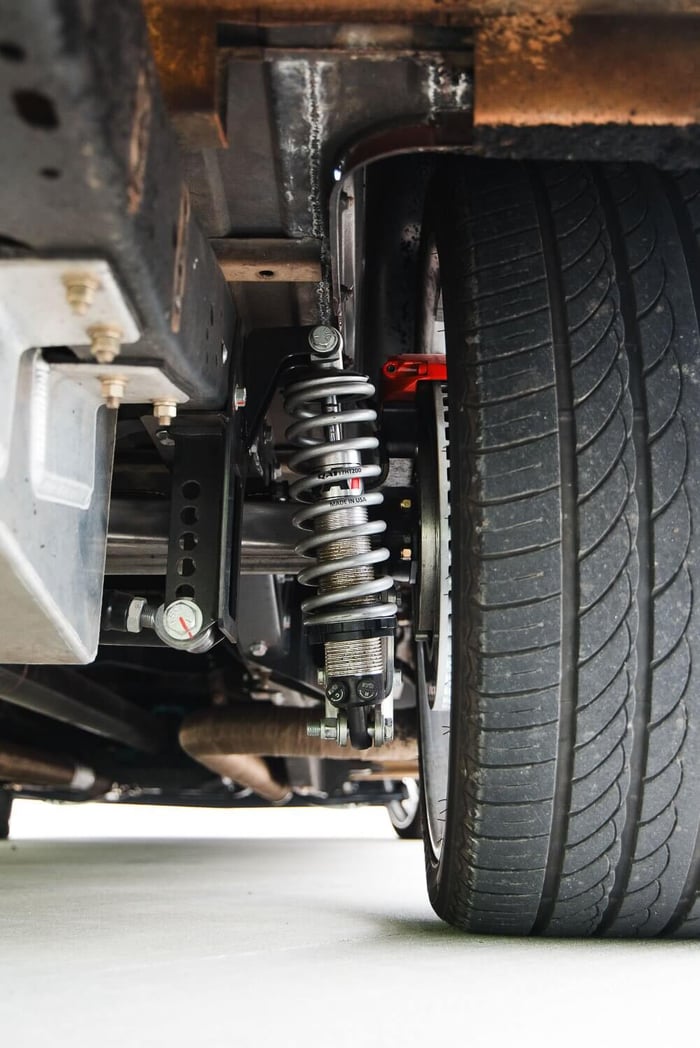View of the torque arm links and QA1 double-adjustable coilovers from the rear.