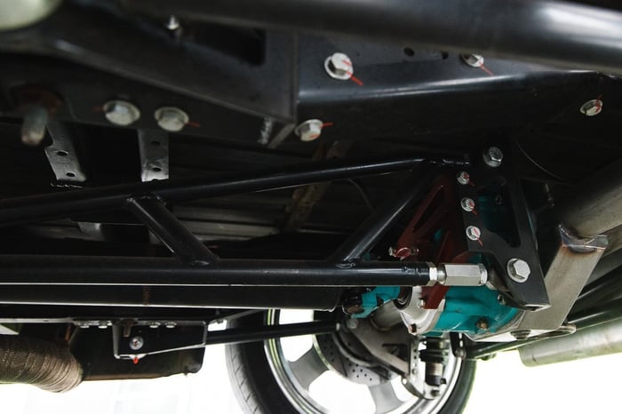 Under-chassis shot showing QA1 torque arm rear suspension setup.