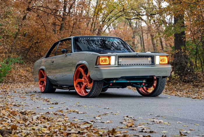 A low-angle view capturing the aggressive stance and QA1 suspension components at work.