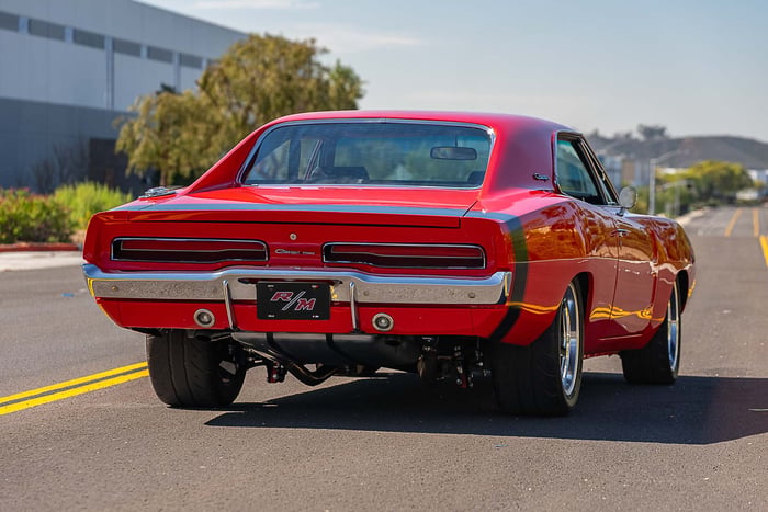 Rear quarter shot showing LED taillights and chrome bumper.