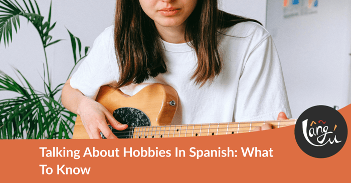 Talking about hobbies in Spanish: a woman in a white shirt playing a brown electric guitar