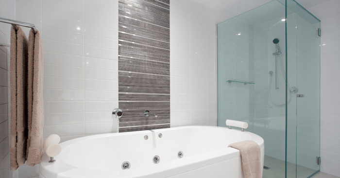 cost of tub to shower conversion depicted by a stylist clean bathroom