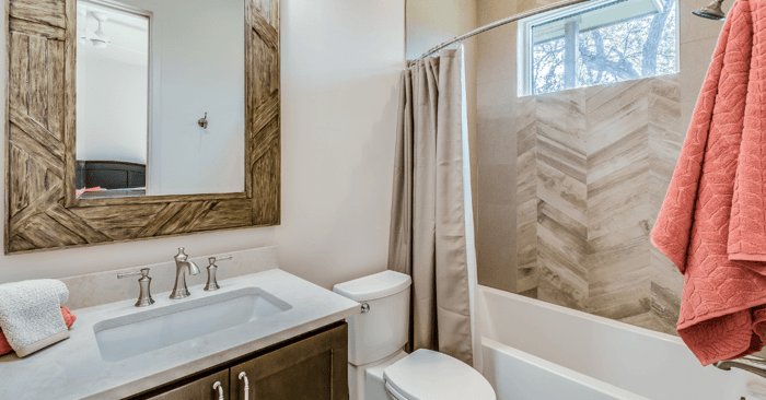 delta shower tub combo depicted with a pic of a bathroom with earth tones