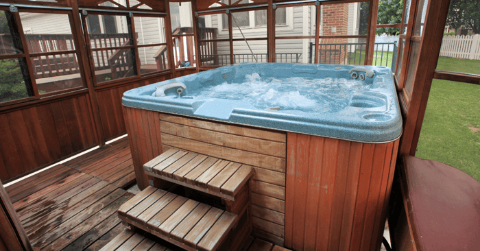 hot tubs shown by a pic of an enclosed hot tub outdoors