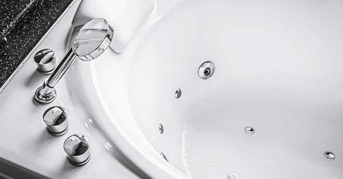 jacuzzi tub and shower combo with showerhead of jacuzzi visible
