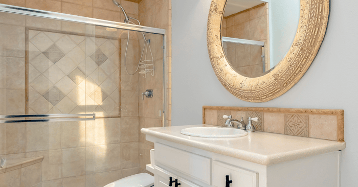 tub shower doors made of glass in a bathroom with tub shower