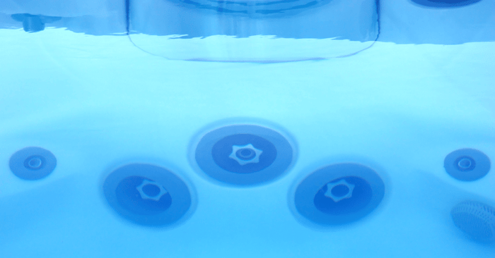 two person jetted whirlpool tub underwater view showing jets and filter