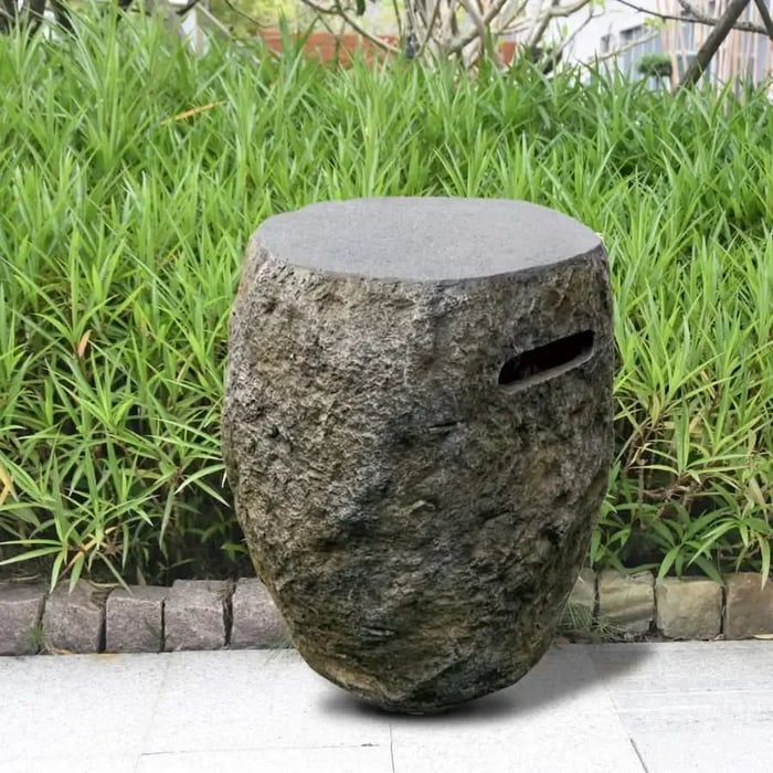 concrete decorative propane tank cover in front of grass