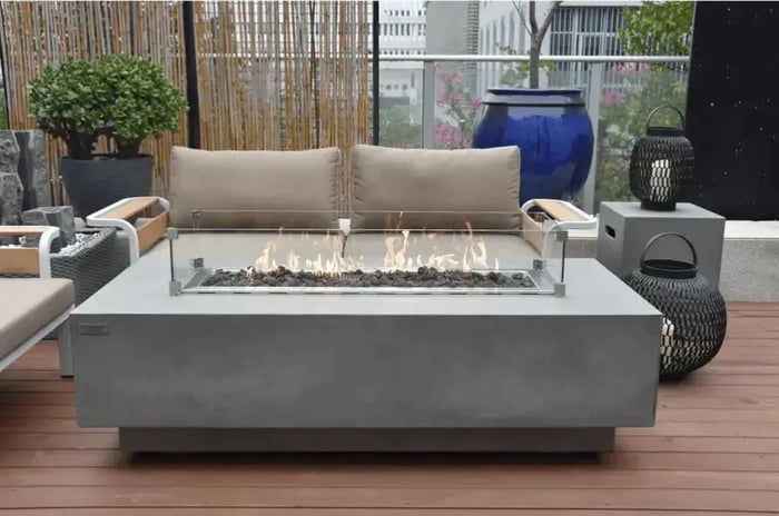 Elementi Granville Rectangular Concrete Fire Pit Table, showcasing its modern design and durable construction. Ideal for creating a cozy outdoor atmosphere.