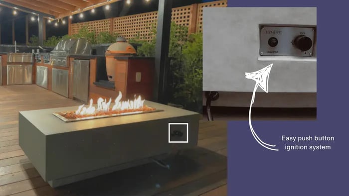 close up of push button ignition on grey outdoor fire pit table in a backyard