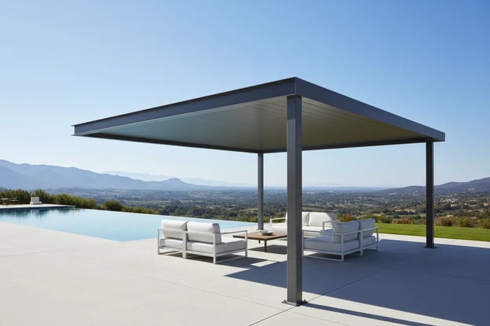 Modern cantilevered pergola with floating roof providing shade over luxury pool deck