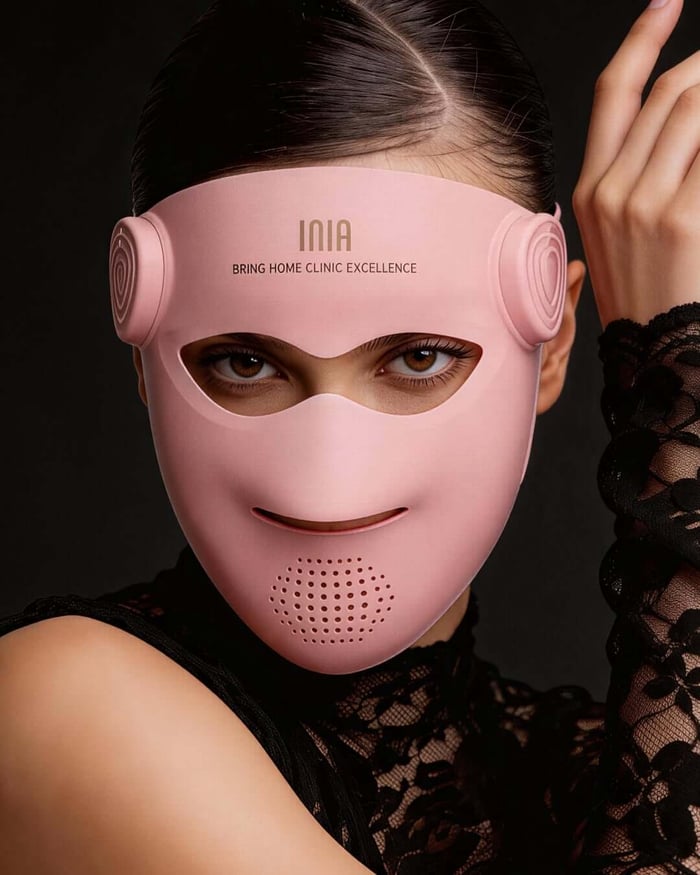Pink INIA red light therapy mask showing its extended lower-face design