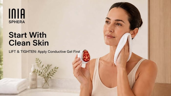 Woman preparing clean skin before using INIA SPHERA, with guidance to apply conductive gel for LIFT and TIGHTEN