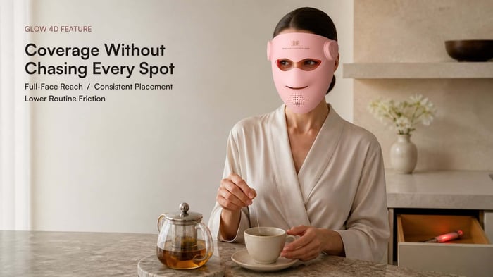 Woman wearing a pink INIA GLOW 4D mask to illustrate full-face coverage without moving a handheld device spot by spot