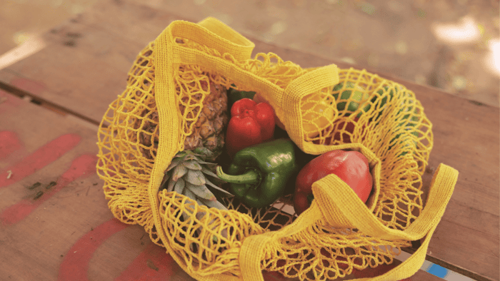 Reusable string bag filled with produce, representing easy zero waste habits you wish you started sooner
