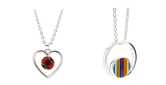 A couple of necklaces with a red eye and a blue circle  Description automatically generated