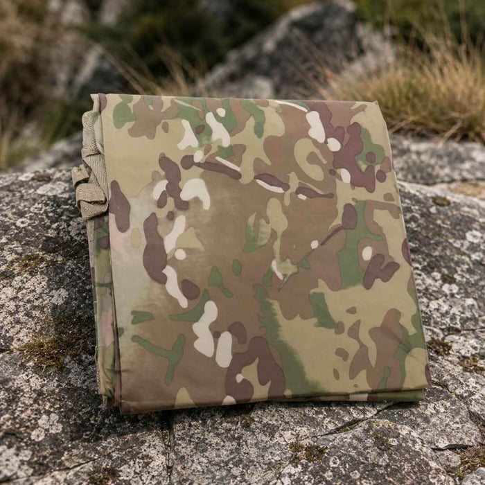 TAS Hoochie folded and laid out on rocky terrain