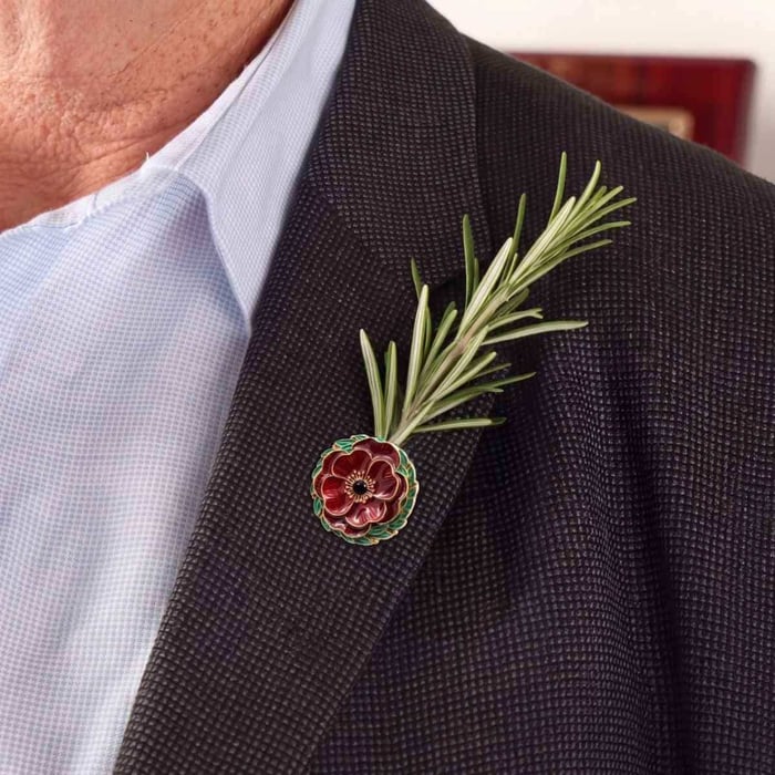 person wearing Red Poppy, ANZAC Rosemary Carrier Lapel Pin