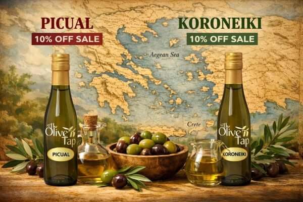 Picual and Koroneiki Bottles of Oil on Sale for 10% Off with a Map of Greece, Olives and Greens