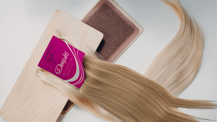 A pair of hair extensions layered on top of each other, highlighting their design and purpose in enhancing hairstyles.