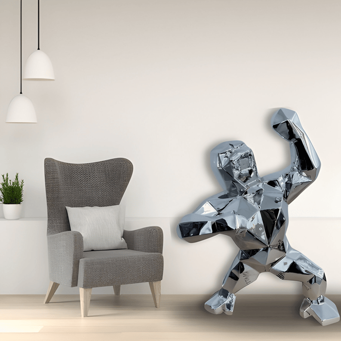Stellar chrome gorilla statue in a modern minimalist setting