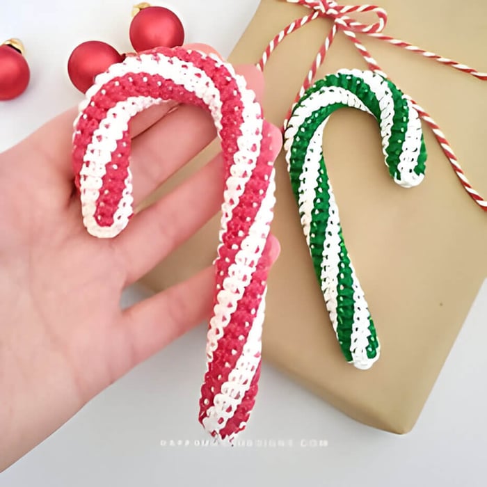 2 crochet striped candy canes, one red and one green