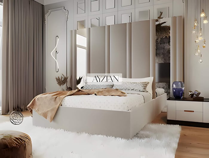 a mirrored headboard in a small room