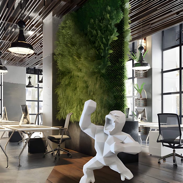 A white stone gorilla statue inside a contemporary office interior design