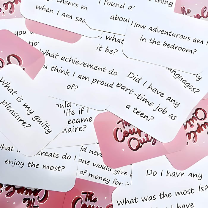Pink and white questions cards from a game