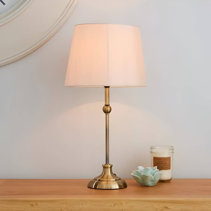 Brass table lamp with pink shade