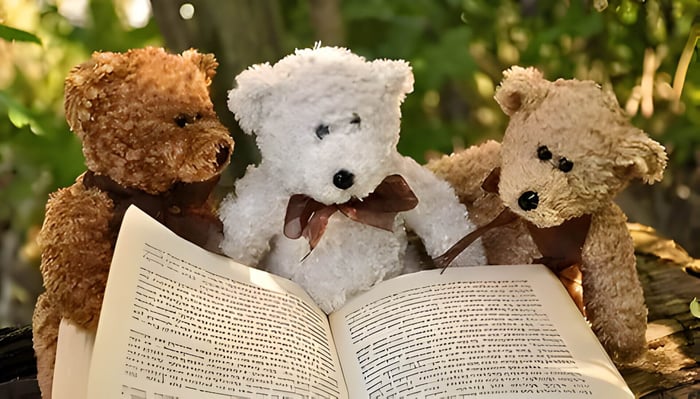 3 teddy bears reading a book