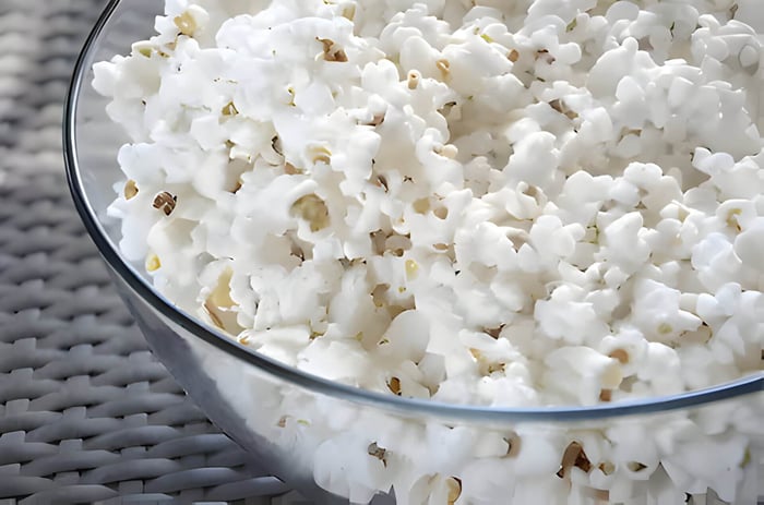 a glass bowl of popcorn